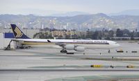 9V-SGE @ KLAX - Taxiing at LAX - by Todd Royer