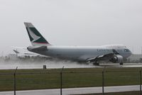 B-LIF @ MIA - Cathay Cargo kicking up rain on the runway