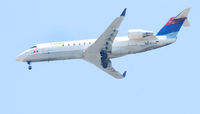N917EV @ ILM - 2003 Bombardier CL-600 flying over downtown  Wilmington N.C. toward the airport. - by Richard T Davis