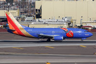 N647SW @ PHX - Southwest Airlines Triple Crown ONE N647SW (FLT SWA605) rolling out after arrival from Lambert-St Louis Int'l (KSTL). - by Dean Heald