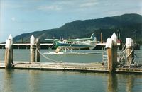 VH-OTR - Photograph by Edwin van Opstal with permission. Scanned from a color print. Photo taken at Cairns  Seaplane base. - by red750