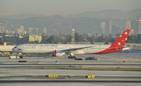 VH-VOZ @ KLAX - Being towed to parking - by Todd Royer