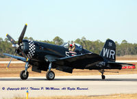 N179PT @ KNPA - A/C BuNo 122179, displaying the markings of VMF-312, The Black Sheep, taxiing in after performing a flight demo at NAS Pensacola. - by Thomas P. McManus