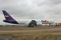 N918FD @ EGGW - Fed Ex Boeing 757-23A, c/n: 24290being towed to the engine run bay after maintenance at Luton - by Terry Fletcher