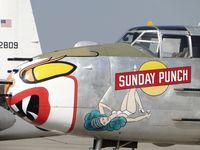 N325N @ CNO - Sunday Punch & Lady nose art on the starboard side of the fuselage - by Helicopterfriend