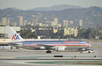 N328AA @ KLAX - Being towed to its Gate - by Todd Royer