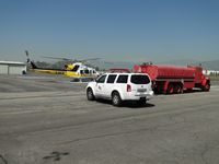 N110LA @ POC - Crewman drives up, Copter 11 starts up and off they go westbound - by Helicopterfriend