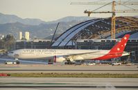 VH-VPH @ KLAX - Getting towed to parking - by Todd Royer