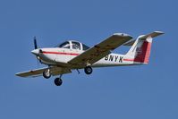 G-BNYK @ EGGP - On approach to runway 27.  Owner is Lomac Aviators Ltd (note tailplane LAL logo). - by Mark J Kopczewski