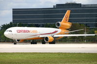 N985AR @ KMIA - Turning onto heavies-rwy 09 at MIA in great sunlight - by Rembrandt Staller