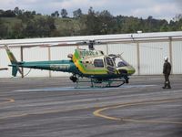 N962LA @ POC - Deputy Tactical Flight Officer checking the area prior to firing up the ship - by Helicopterfriend