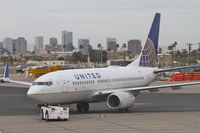 N23707 @ KPHX - United Airlines Boeing 737-724, UAL1235 pushing from  Gate 8 KPHX, for a trip to trip to Cleveland-Hopkins Int'l/KCLE. - by Mark Kalfas