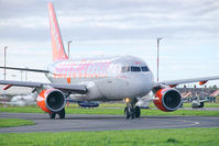 G-EZGA @ EGGP - 'Pride of Lisbon' on taxiway A1 en-route to runway 27. - by Mark J Kopczewski