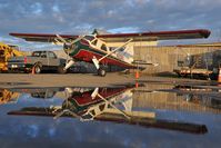 N203KL @ LHD - Alaska Air Taxi Dash 2 - reflection - by Dietmar Schreiber - VAP