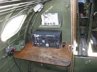 N93012 @ CMA - 1944 Boeing B-17G FLYING FORTRESS 'Nine O Nine', four turbocharged Wright Cyclone R-1820-97 1,200 Hp each, Radioman's compartment. Note: Morse code key to right of transceiver on desk and crew alarm bell - by Doug Robertson