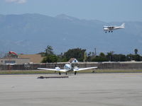 N3101W @ OXR - 1973 Beech E55 BARON, two Continental IO-520-C 285 Hp each, holding short Rwy 25. N10033 2005 Cessna 172S SKYHAWK SP on final Rwy 25, a twofer - by Doug Robertson