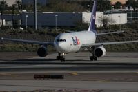 N689FE @ PHX - Taken at Phoenix Sky Harbor Airport, in March 2011 whilst on an Aeroprint Aviation tour - by Steve Staunton
