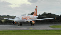 G-EZMH @ EGPH - Easyjet A319 Turning onto taxiway bravo 1 - by Mike stanners