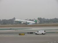 B-16111 @ LAX - Smokin em on touch down on 24R - by Helicopterfriend