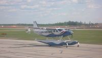 C-GKOM @ CYMM - Taxiying by on ramp at Fort McMurray - by Tony Oxlade