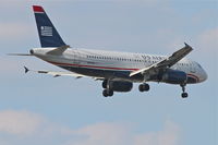 N604AW @ KORD - US Airways Airbus A320-232, AWE 5 arriving from Phoenix/KPHX, RWY 10 approach KORD. - by Mark Kalfas