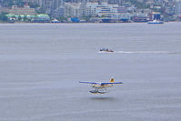 C-FIUZ @ CYHC - About to touch down at Vancouver Harbor - by Murat Tanyel