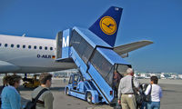 D-AILR @ MUC - Passengers embarking on the plane to fly to ESB from MUC on 09/22/2006. - by Murat Tanyel