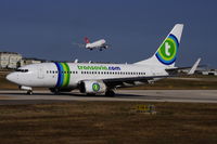 PH-XRB @ LMML - B737-700 PH-XRB Transavia.com taxying out from thr main apron for departure. - by raymond