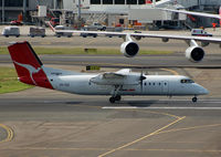 VH-TQZ @ YSSY - The Dash-8 easily fits under the wing of a B747... - by Micha Lueck