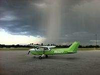 N64477 - Parked at the Romeo airport Ramp in Michigan waiting out a small rain cell with lightning. - by Scott Anttila