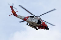 6043 @ ORF - US Coast Guard Sikorsky MH-60T Jayhawk 164097 scanning the Norfolk International Airport area prior to the arrival of President Barack Obama. - by Dean Heald