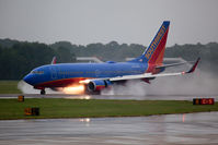 N726SW @ ORF - Southwest Airlines N726SW (FLT SWA1257) rolling out on RWY 5 in the rain after arrival from Nashville Int'l (KBNA). - by Dean Heald