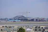 HL8211 @ KLAX - Korean Air taxiing with the new Tom Bradley terminal in the background - by speedbrds