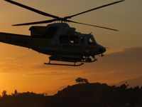 N14LA @ POC - Called out at sunset and heading northbound across the active runways - by Helicopterfriend