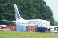 EI-DTU @ EGBP - Transaero Airlines B737 in the scrapping area at Kemble - by Chris Hall
