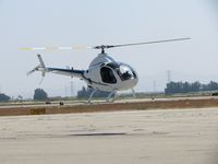 N4070A @ CNO - Hovering after checking for traffic and awaiting clearence for take off - by Helicopterfriend