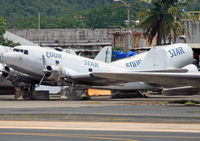 N136FS @ TJSJ - Ever since a fire broke out in the cockpit in 2009, this DC-3 (in the background, behind N138FS) has never been quite the same. - by Daniel L. Berek