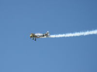 N1038A @ CMA - 1944 North American SNJ-5 WAR DOG, P&W R-1340 Wasp 600 Hp, low level aerobatics with smoke - by Doug Robertson