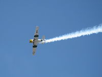 N1038A @ CMA - 1944 North American SNJ-5 War Dog, P&W R-1340 Wasp 600 Hp, low level aerobatics with smoke - by Doug Robertson