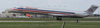 N7527A @ KAUS - AAL MD82 touches down 17L. - by Darryl Roach
