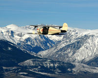 N79091 - N79091 over mountain range - by MCIA