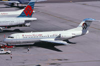 N537YV @ KPHX - One of two Fokker 70s operated by America West Express. Seen here at PHX in March 1997. - by John Meneely