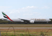 A6-ECT @ YBBN - Emirates Boeing 777 - by Thomas Ranner