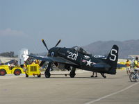 N7825C @ CMA - 1949 Grumman F8F-2 BEARCAT, P&W R-2800-34W 2,100 Hp, in tow on flight line. Aircraft is a 1949, not 1948 as registered. - by Doug Robertson