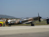 N749DP @ CMA - 1983 Vickers/Supermarine SPITFIRE Mk.XIVe, Rolls Royce GRIFFON 65 V-12 2,050 Hp, 5-blade prop, spotting on flight line - by Doug Robertson