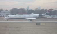 N723PS @ CLT - US Airways CRJ-700 out dirty window of N744P