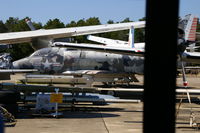 145077 @ KNPA - Stuffed among broken up planes - by Glenn E. Chatfield