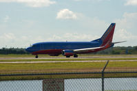 N356SW @ RSW - 40 minutes after arriving from Orlando 737 departs enroute Chicago Midway - by Mauricio Morro