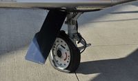 N3000B @ KOSH - Blown tire on landing after demo flight - by Todd Royer