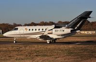 5V-TTM @ EGHH - Taxiing to departure point. - by John Coates